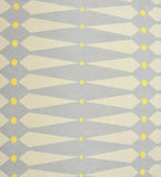 Luxury handwoven rug with geometric diamond patterns in beige, gray, and yellow accents