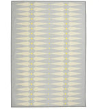 Handwoven luxury rug with a geometric diamond pattern in soft grey, cream, and yellow accents