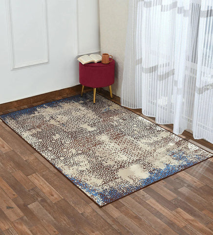 Machine washable mosaic area rug in muted tones.