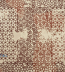 Low-profile distressed rug with teal and terracotta accents.
