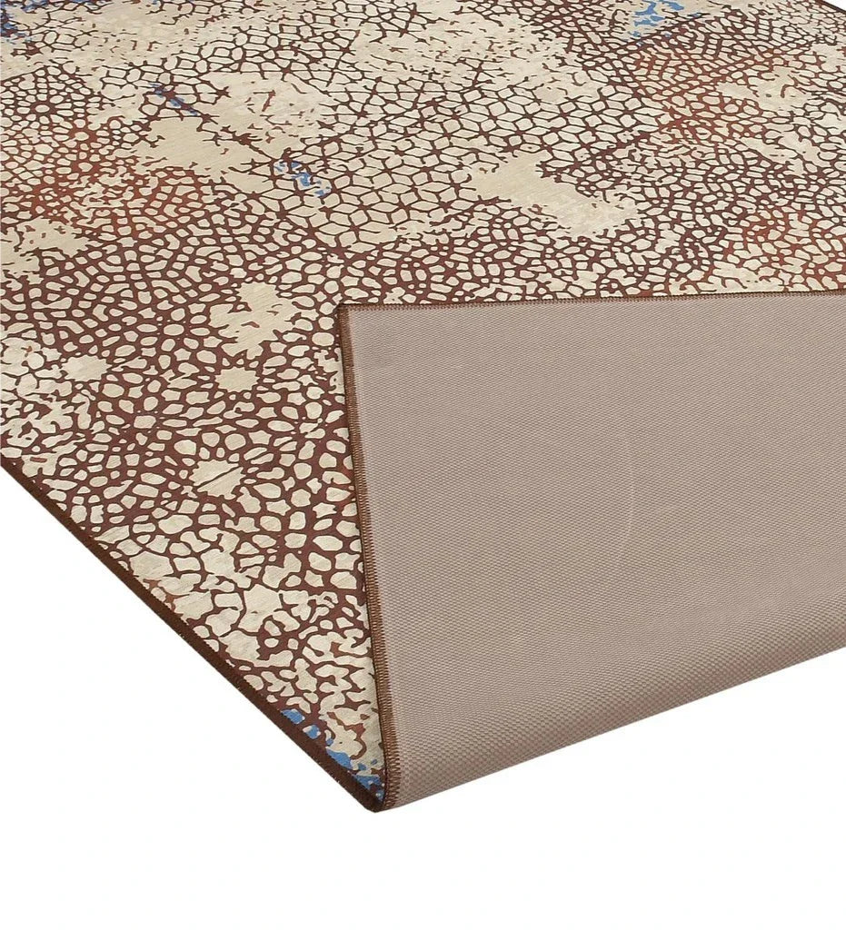 Durable mosaic patterned rug for bohemian and transitional spaces.