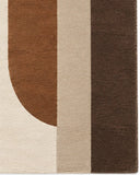 A rectangular area rug with a retro mid-century modern abstract design featuring curved arches in olive green, terracotta brown, taupe, cream, and dark brown on a cream background.