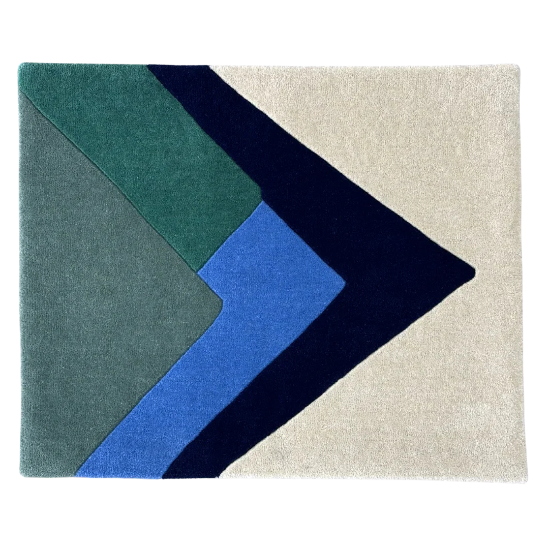 Geometric rug with blue, green, and beige colors on a white background