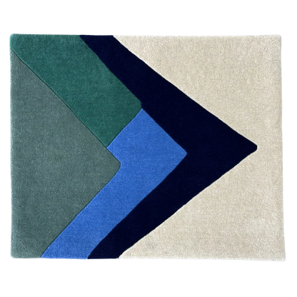 Geometric rug with blue, green, and beige colors on a white background