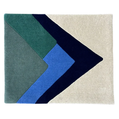 Geometric rug with blue, green, and beige colors on a white background