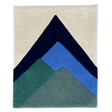 Earthy abstract mountain peaks rug in green, blue, navy, and beige colors by Mannat Rugs