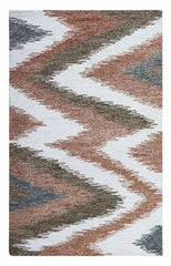 Hand-tufted chevron wool rug in brown and grey zigzag design.