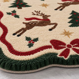 A close-up of a tufted area rug with a Christmas theme, featuring brown reindeer with red scarves, green Christmas trees, red bows, holly, and gold stars on an off-white background.