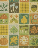 Fall-themed patchwork rug with illustrations of mushrooms, pumpkin, pear, leaves, acorn, flower, and checkered patterns