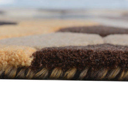 Close-up of a textured brown and beige hand tufted rug 