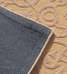 Handcrafted wool rug with elegant gold damask-inspired motif