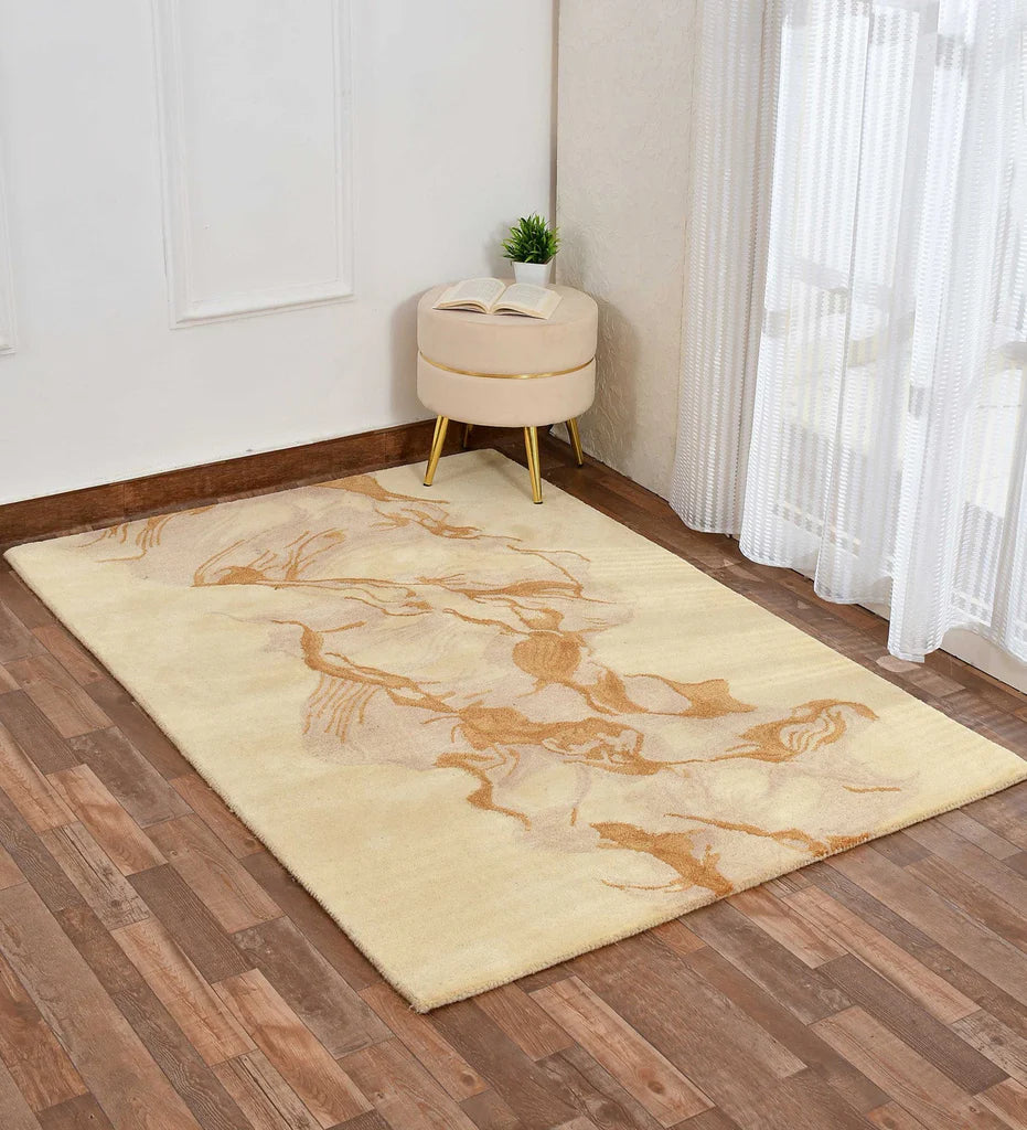 Vibrant abstract wool rug in gold and beige tones.