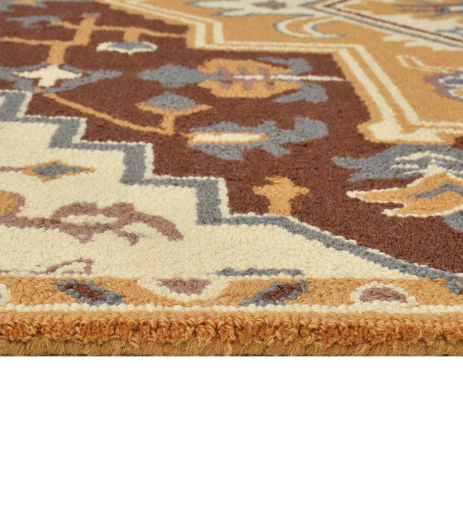 Classic wool rug with gold, ivory, and blue geometric details