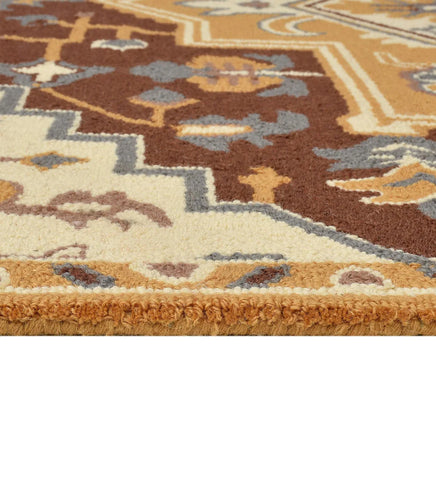 Classic wool rug with gold, ivory, and blue geometric details