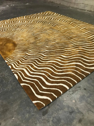 Modern abstract gold and beige wave pattern wool rug