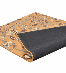 Hand-tufted wool rug in gold with brown and cream floral design