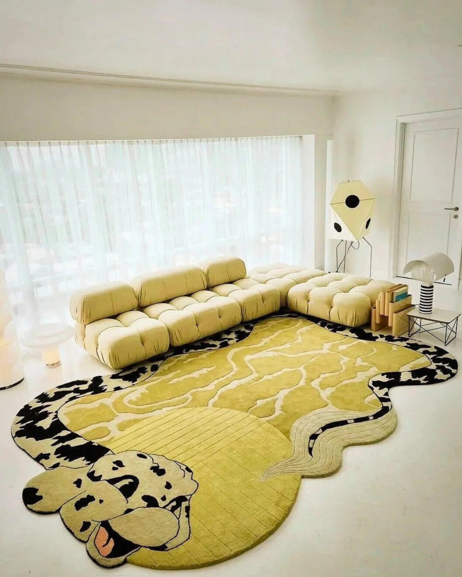 Modern hand-tufted wool rug featuring golden yellow base and coiled snake motif
