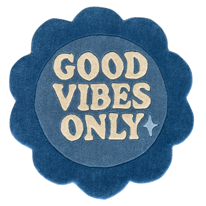 Blue circular rug flower shaped with 'Good Vibes Only'