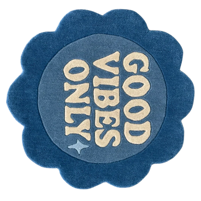 Round blue rug with 'Good Vibes Only' flower shaped
