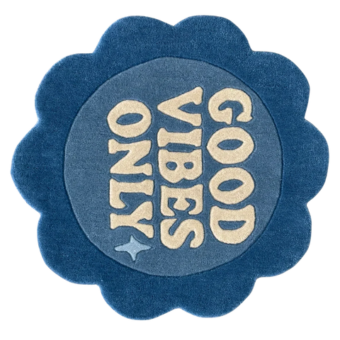 Round blue rug with 'Good Vibes Only' flower shaped