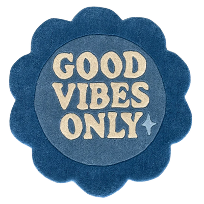 Blue circular rug flower shaped with 'Good Vibes Only'