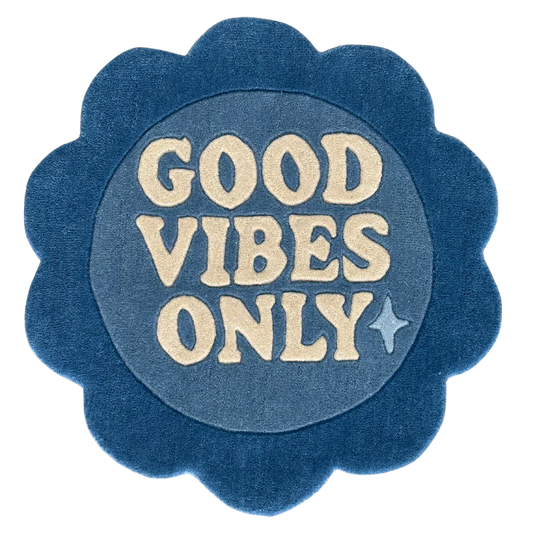 Blue circular rug flower shaped with 'Good Vibes Only'