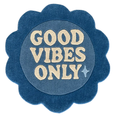 Blue circular rug flower shaped with 'Good Vibes Only'