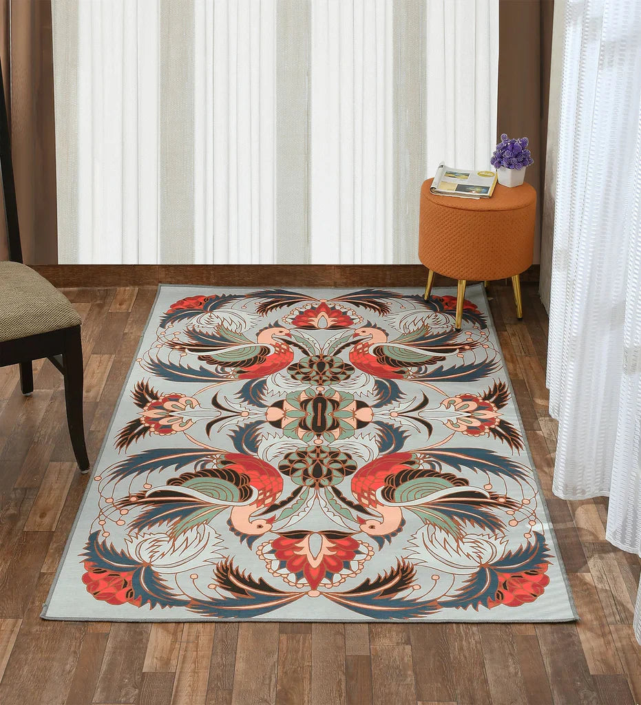 Machine washable gray area rug with bird and floral design.