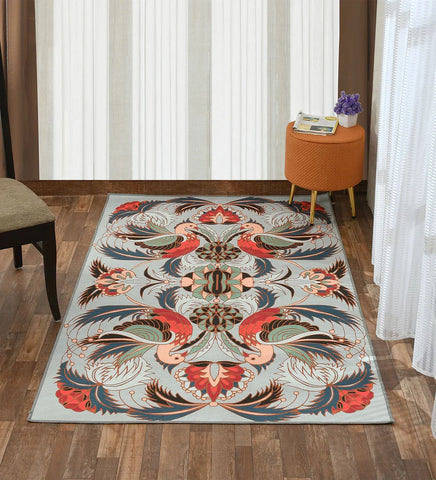 Machine washable gray area rug with bird and floral design.