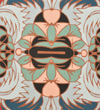 Close-up of a luxury handwoven floral rug with gray, mint, peach, black, and blue symmetrical patterns