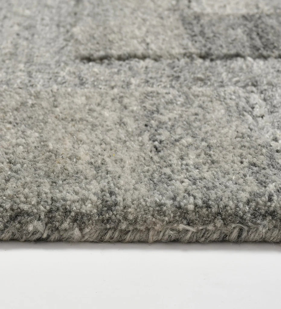 Textured grey and silver geometric wool rug for living room decor