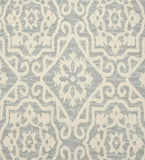 Gray and ivory geometric floral patterned luxury rug with handwoven texture from Mannat Rugs