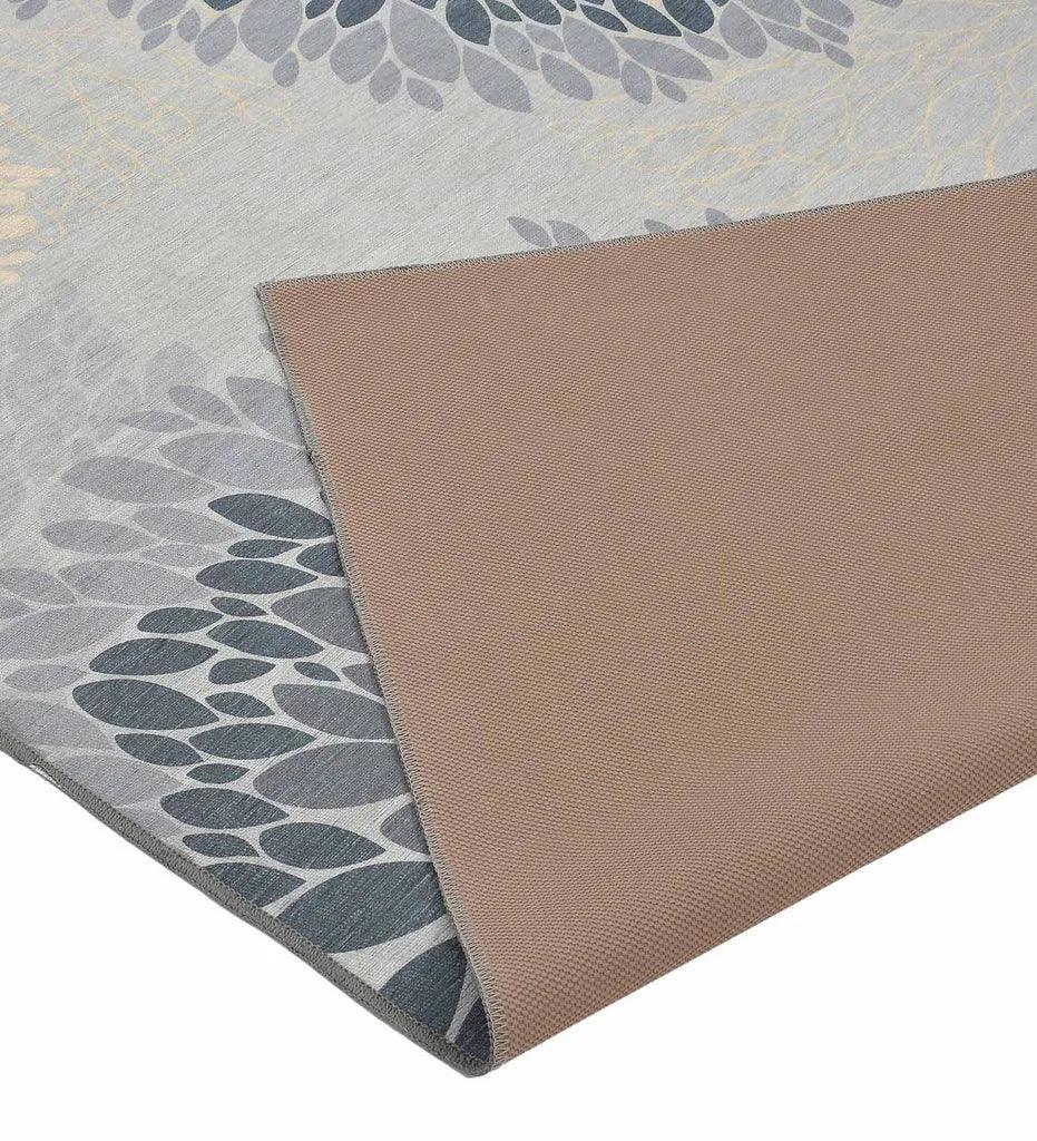 Machine washable rug with modern floral design.