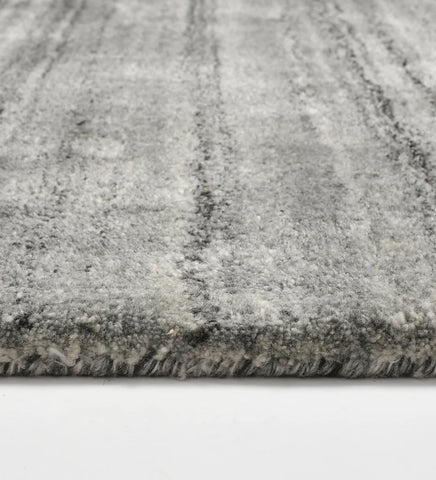 Minimalist grey hand-tufted rug with subtle striped detailing