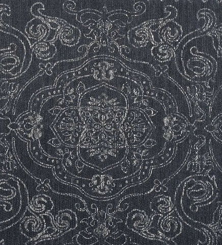 Elegant gray area rug with intricate border design.