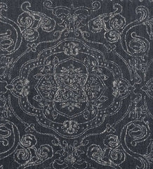 Elegant gray area rug with intricate border design.