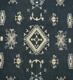 Gray tribal medallion border design luxury rug with intricate organic patterns on dark background