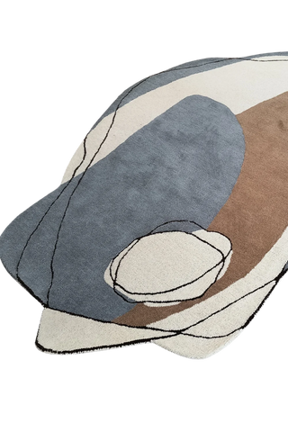 Luxury artisan wool rug with beige, ivory, and charcoal abstract design.