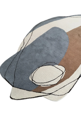 Luxury artisan wool rug with beige, ivory, and charcoal abstract design.