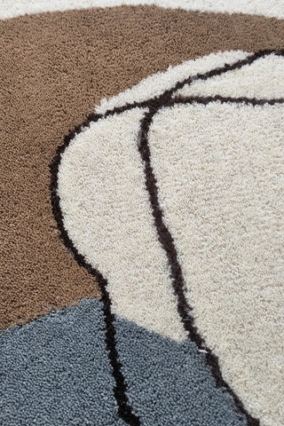Hand-tufted wool rug in beige, brown, and grey for living room decor.