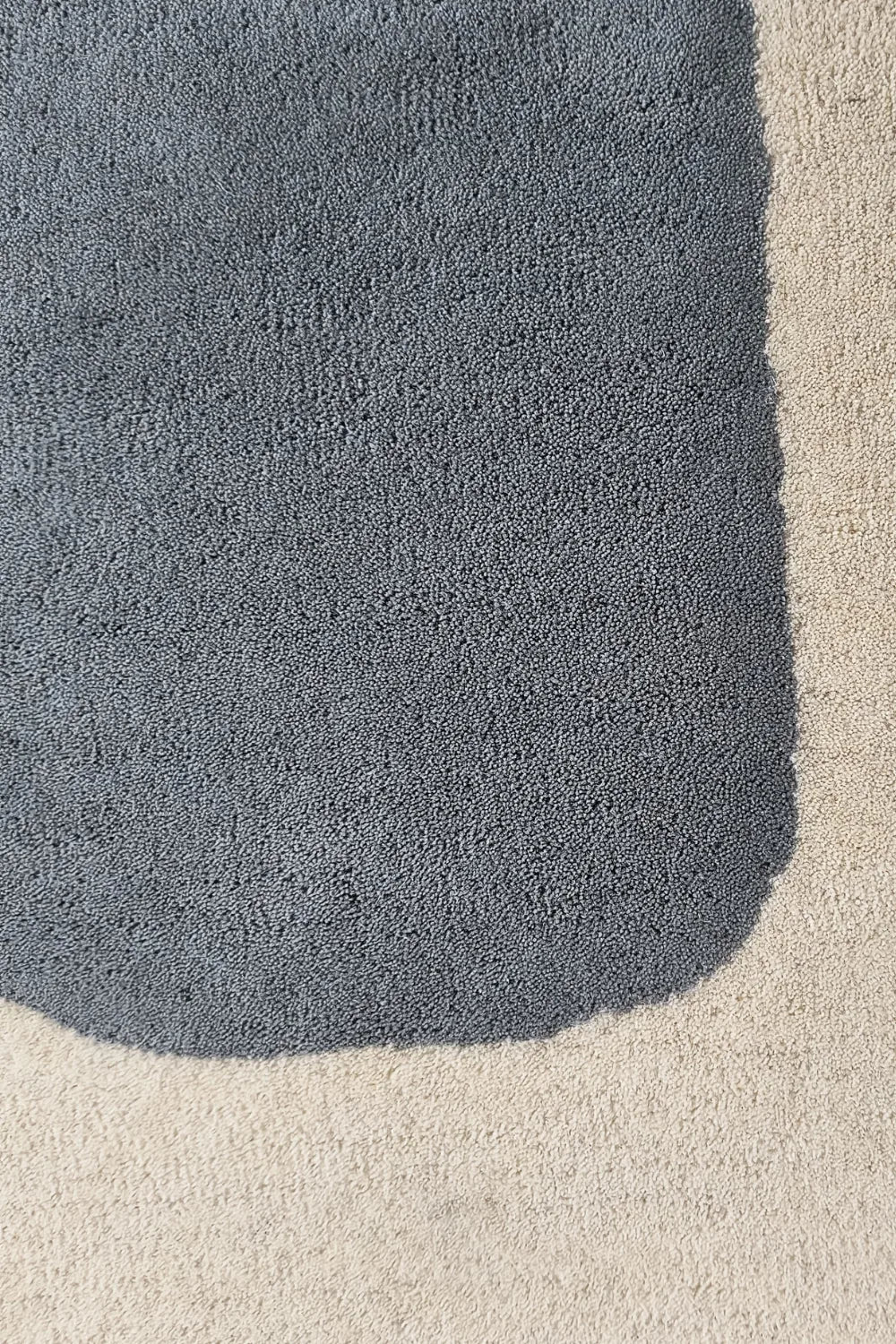 Artistic area rug with overlapping geometric forms and sketch outlines.