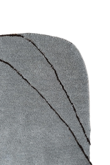 Modern abstract wool rug in neutral grey and warm brown tones.