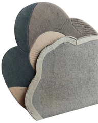 Artistic sculptural rug with abstract organic shapes.