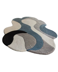 Modern neutral rug with layered pattern in beige and charcoal.