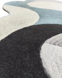 Handcrafted premium wool rug in neutral gray tones.