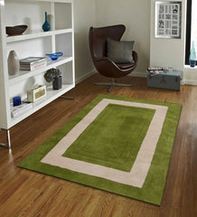 Minimalist bordered rug in green and ivory modern design