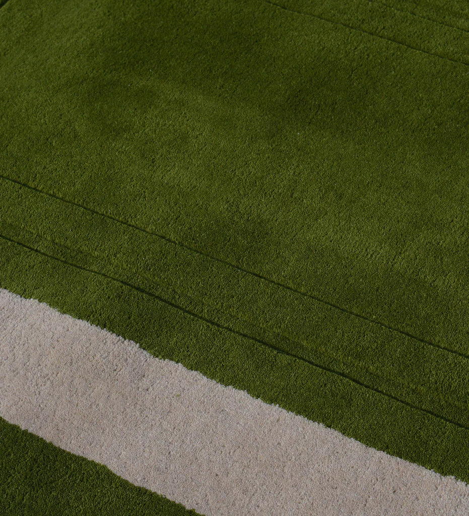Luxury wool rug with embossed rectangle detail in green tones