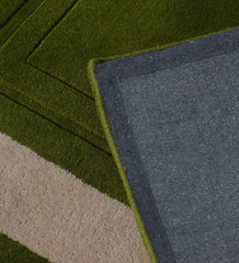 Contemporary green and ivory bordered hand-tufted rug