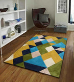 Colorful geometric wool rug in blue, yellow, green, and cream in modern living room with wooden floor