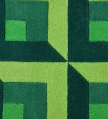 Luxury wool rug with bold geometric design in green shades